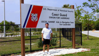 March 2014 - Chet Gay and the entrance sign for Coast Guard Station Ft. Lauderdale