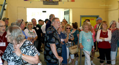 Hialeah High School Class of 1965 classmates being briefed before the tour of Hialeah High