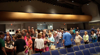 Hialeah High School Class of 1965 classmates leaving the auditorium for the next part of the tour of Hialeah High