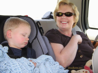 July 2007 - our sleeping grandson Kyler and grandma Karen in the back seat of a car