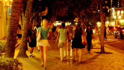 Tourists out and about at night somewhere near the Hyatt Regency Waikiki