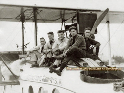 1920-1924 - Three Aeromarine Airways Miami-based pilots and two mechanics sitting on Aeromarine's converted Model 75
