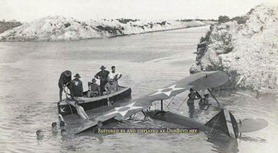 1920's - U. S. Navy bi-plane in the newly dug Miami Canal near Curtiss Airfield in Hialeah on the other side of the canal