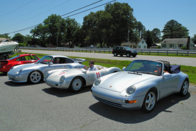 A replica of a 1955 Porsche 550 Spyder is flanked by two 993-generation 911s. (1090)