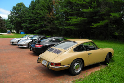 4 of 25 cars in the tour, with Sand Beige 1968 Porsche 911 L in the foreground. (1318)