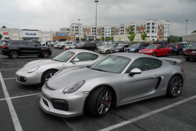 2016 Porsche Cayman GT4, foreground, and 2009 Porsche Cayman (1147)