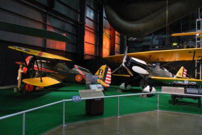 Left, Boeing P-12E fighter used by the Army and Navy (as F4B) between WWI and WWII. Right, Army's Curtiss P-6E Hawk (8017)