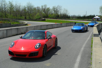 2018 Porsche 911 T leads two 2018 911 4S's around the race track. (2671)