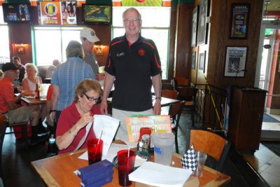 Guest rally masters Jim and Diane score the gimmick rally answer sheets. (2961)