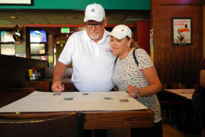 Al and Vicki review the explanatory charts of the gimmick rally. (2981)