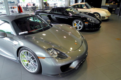 DISPLAY OF SIGNIFICANT PORSCHES: 2015 Porsche 918 Spyder, 2004 Porsche Carrera GT, 1988 Porsche 959 Komfort (3242)