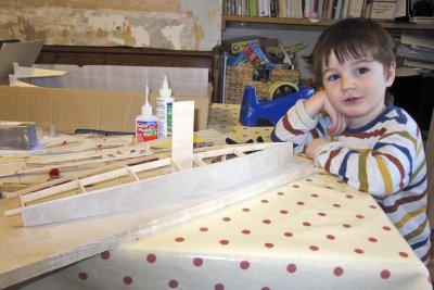 Timothy works on the sailboat