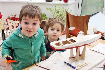 Timothy and Nicholas work on the sailboat