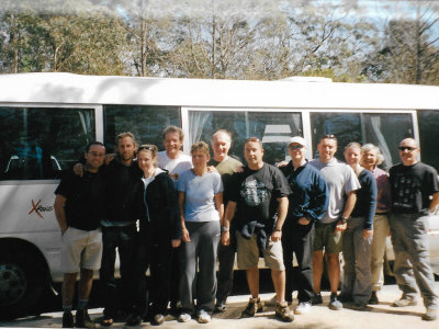 The group posing outside our vehicle