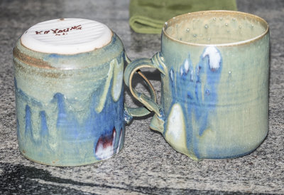 Coffee mugs by the same potter
