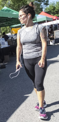 Woman at the market with earphones