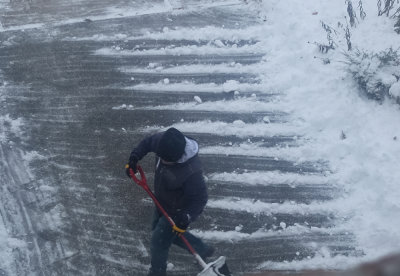 First snow, my neighbor cleaning his driveway.