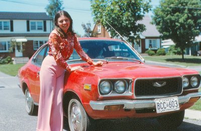 My wife and her first car, a Mazda 808