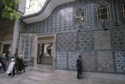 Tiles of wall holding the mausoleum