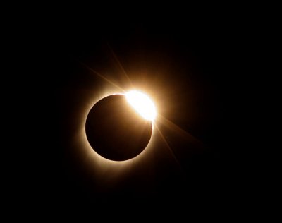 The Diamond Ring appears as the moon starts its exit from the sun