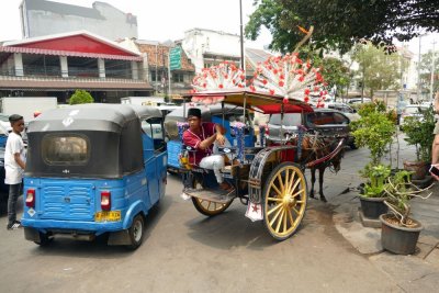Riding in motorized rickshaws thru Jarkata