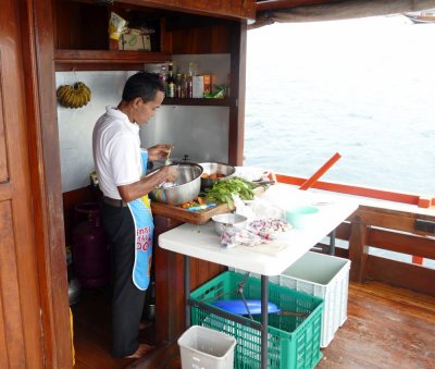 The boat's chef, preparing ingredients for our lunch