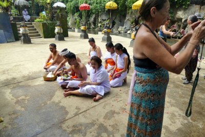 A group waiting for the priest to bless their offering