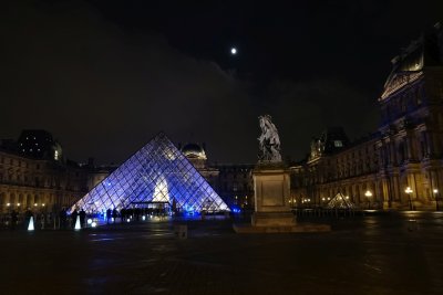 The Pyramid, a sculpture of Louis XIV on horseback, and a not quite full moon