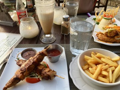 Jerk chicken skewers and fries