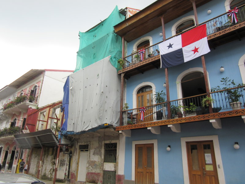 Three buildings at different stages of restoration