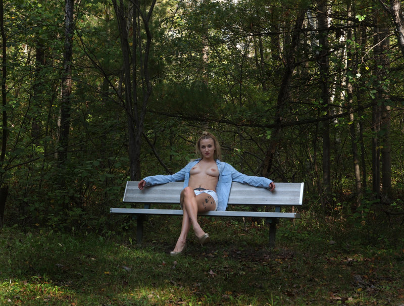 Just A Girl On A Bench In The Woods...