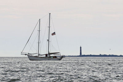 EE5A1394 Overcast sailing under power Morris Island light.jpg