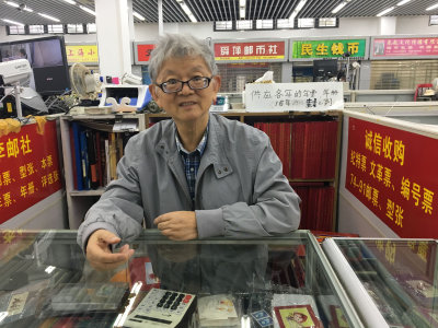 Dealer at the Stamp Market