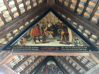 Paintings in Chapel Bridge depicting local history