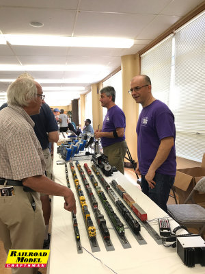 Dan and John from TSG Multimedia staff their table full of beautifully detailed locomotives.