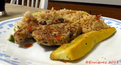 Pork chop and rice casserole with baked zucchini