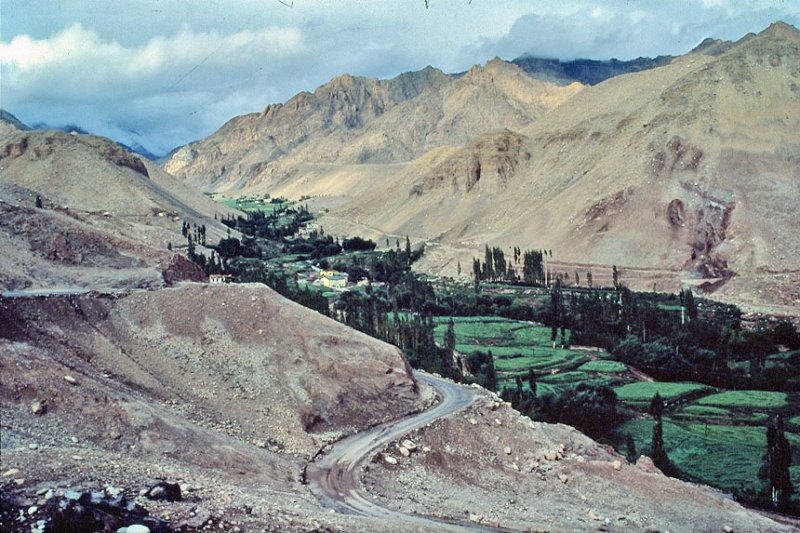 Green valley with dark clouds.jpeg