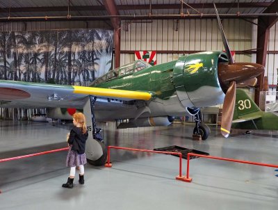 Gabriella impressed by a WW II Japonese aircraft. 