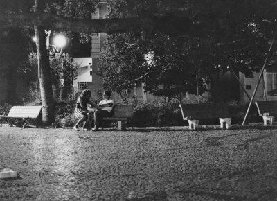 Couple resting, at Praça 15 de Novembro.