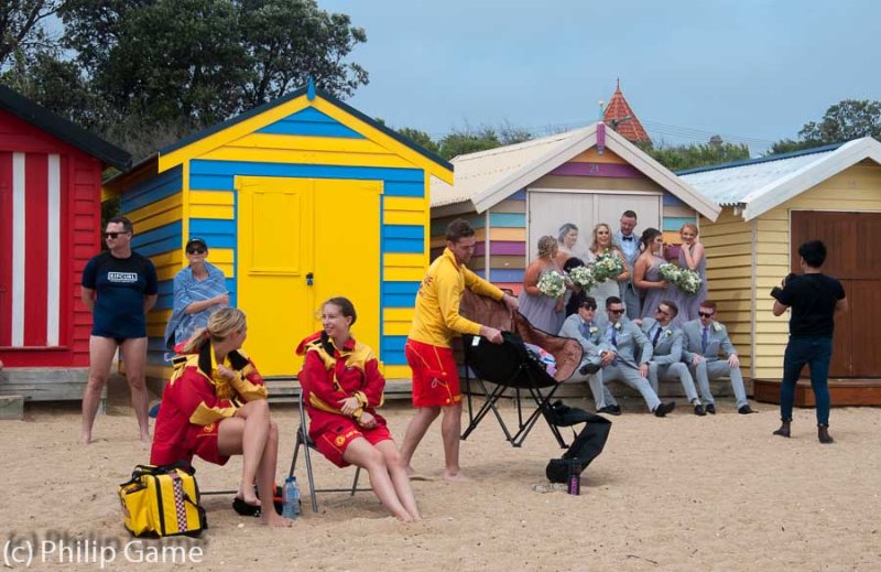 Surf lifesavers get distracted by the photo shoot!