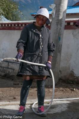 Womens work: mixing concrete! Tibet