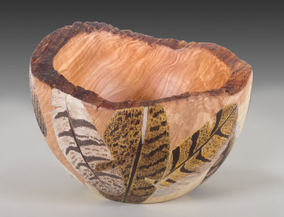 Bowl with feather carvings.