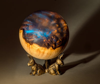 Maple Burl with Acrylic resin turned into a sphere.