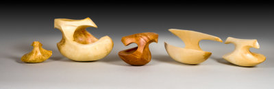 Birch carvings with a tippy bottom give a delightful motion to the piece.