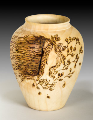 Paul turned this vase and collaborated with Joanne Sauvageau for the pyrography.
