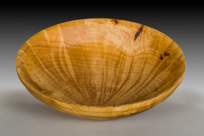 Burch burl bowl with beautiful pattern in the rays comming from the wood.
