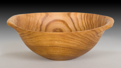 Elm bowl turned with handles.