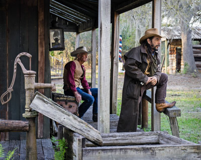 2 Cowboys on  Porch by Pump