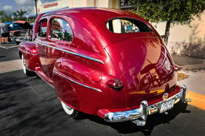 Red Swept Back Ford Sedan