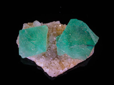 Fluorite, luminous green octahedra to 18 mm across on 33 mm quartz matrix. Riemvasmaak, Kakamas, South Africa